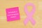 Reminder to schedule mammogram pink cancer ribbon