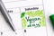 Reminder Vegan Day in calendar with green pen.