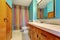 Remodeled bathroom interior with colorful shower curtain