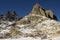 A remote cabin for hikers below a peak in the mountains of Corsica