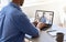 Remote Communication. Unrecognizable Businessman Teleconferencing With Colleagues, Using Laptop Computer In Office