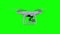 Remote control air drone drone flying with action camera. Isolated on green screen background