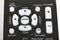 Remote control keypad black in closeup on white isolated