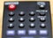 Remote control number buttons close-up on TV remote control with out of focus elements