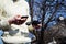 Remote control and smartphone in male hands. A man holding a transmitter and piloting some vehicles. A drone, radio controlled car