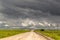 Remote Dirt Track Leads to Stormy Horizon