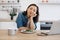 Remote employee sitting at table with laptop and salad