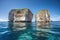 remote island with crystal-clear water and towering rock formations