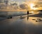 Remote Jamaican beach wth silhouetted woman walking