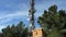 Remote mountain communications center with antennas on steel tower against a  sky.