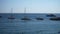 Remote view of ships and vacation rental yachts docked in small marina port in Italian Amalfi coast bay. Slow and lazy