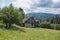 Remote wooden house in green summer Carpathian mountains