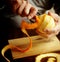 Removing the orange zest with a peeler