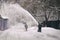 Removing snow from the moscow street using snow blower