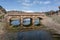 Renaissance bridge from the 17th century over the Salado river. Riba de Santiuste, Spain