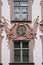 Renaissance facade with stucco decorations and religious painting