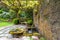 Renaissance Lion Head Water Fountain Under Wisteria Trellis