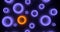 Render of group glowing violet torus and one orange. On black background