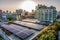 Renewable energy adoption and combatting climate change, an urban rooftop is adorned with solar panels, generating clean and