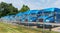 Reno, Pennsylvania, USA June 26, 2022 A line of blue tractor trailer cabs behind a chain link fence