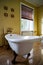 Renovated old-styled bathroom with beautiful retro bath