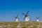 Renovated windmills with black wooden lined blades on the horizon in Campo de Criptana, Castille La Mancha, Toledo,