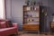 Renovated wooden bookcase with geometrical pattern and a brass f