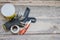 Renovation and construction concept, toolings on wooden floor background, working gloves, spatula, putty, knife and grid