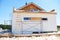 Renovation house wall with plastering, foundation insulation, stucco, repair eaves, attic insulation.