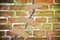 Renovation of an old cracked brick wall - concept image with bandaid patch