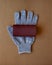 Renovation tools: a roll of sandpaper on working glove