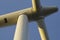 Renowned energies. Wind energy power. Windmill turbine on blue sky