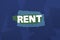 Rent against digitally generated blue paper strewn