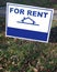 FOR RENT sign featuring generic house