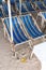 Rental beach canvas chairs and white table on natural white sand