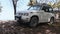 Rented off-road car parked in tropical bush near the beach, Car rental in Africa