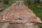 Repair of the country dirt road with the help of brick and stone in Russia poor repair of the road covered with cobblestones and