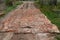Repair of the country dirt road with the help of brick and stone in Russia poor repair of the road covered with cobblestones and