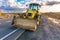 Repair of damaged sections of road with heavy machinery