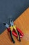 Repair industry tools lie on the edge of the table. background industrial set pliers hand tools