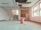 Repair leak water pipe in under gypsum ceiling interior office building and bucket water