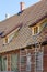Repair of the roof structures of a historic wooden house and replacement of clay tiles