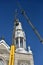 Repair of the steeple of the church of Saint-Pie in Quebec with two cranes