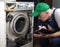 Repair of washing machines, large household appliances. The master examines the disassembled washing machine and records
