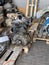 Repaired engine gearboxes lie on wooden pallets in the shed