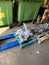 Repaired engine gearboxes lie on wooden pallets in the shed