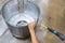 Repairer using a high-pressure water to rinsing the dirty washing machine tub,clean and remove dirt stuck,mold stains on the tank