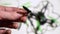 Repairing drone quadcopter in service, man fixing propellers