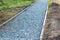 Repairing paths in the Park, installing curbs and sprinkling gravel before laying paving slabs