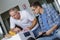 Repairman and apprentice repairing washing machine